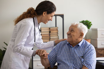 Nurse helping elderly patient
